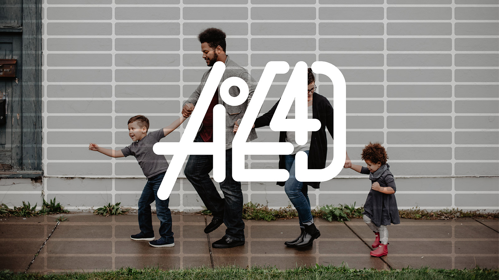 a racially diverse family walking on a sidewalk with the aoe4d logo floating on top