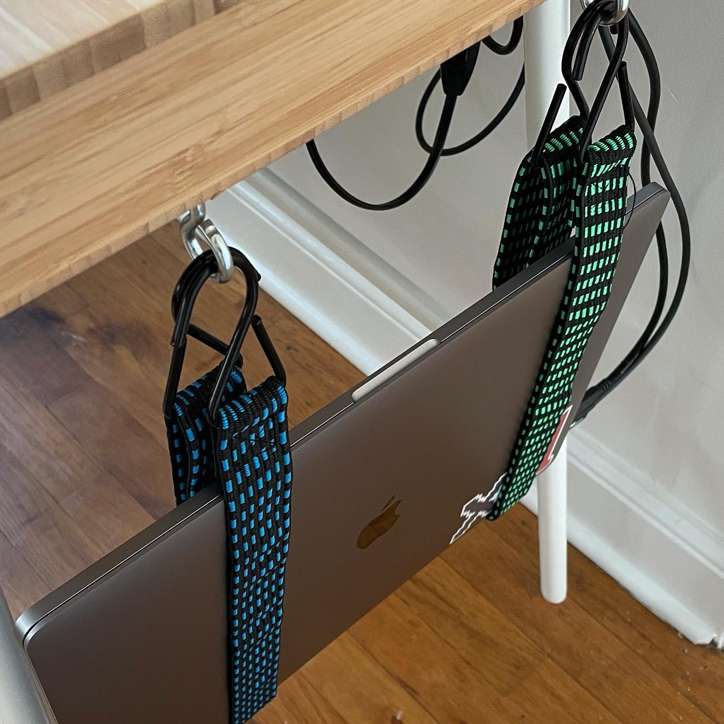 Small WFH desk? Bungee. My MacBook Pro is just hangin’ around.