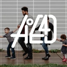 a racially diverse family walking on a sidewalk with the aoe4d logo floating on top